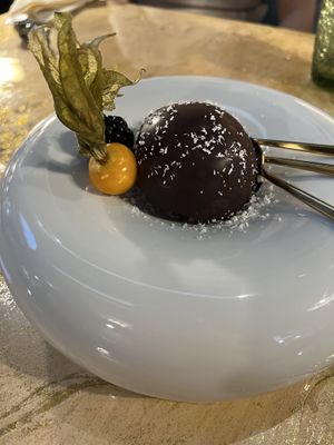 Amazing raspberry mousse covered in dark chocolate.  We were already stuffed, but ordered this anyway and were so glad we did.  at Vrindaa in Rome