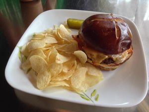Seitan cheeseburger on pretzel roll at Tiger Lily Cafe in Chesterton