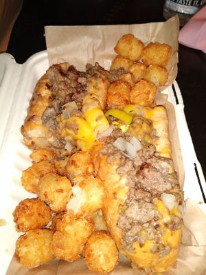 Vegan philly cheese steak made with impossible meat and Slutty Vegan's cheese and tots at Bar Vegan ATL in Atlanta