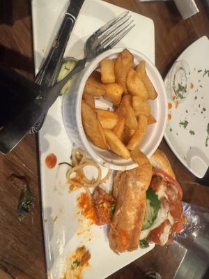 Buffalo chicken sandwich and steak fries   at Bar Vegan ATL in Atlanta