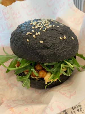 Harissa Chickpea, beetroot hummus, sundried tomatoes and rocket on a charcoal
vrioche at Sweet Nothing Bakehouse in East London
