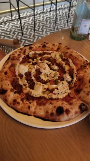 Hawaiian (pineapple, bbq sauce, cashew mozzarella, smoked mushroom bacon, ranch, sliced jalapeños) at PLANTA in West Palm Beach