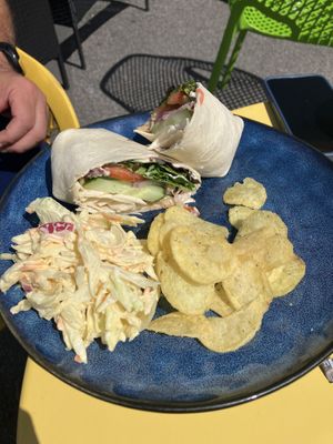 Chicken salad wrap with coleslaw and chips   at Scoff's in Horsforth