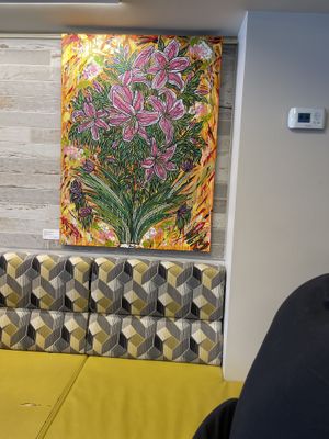 Paintings on sale on the wall   at Good Eats Cafe in Ottawa