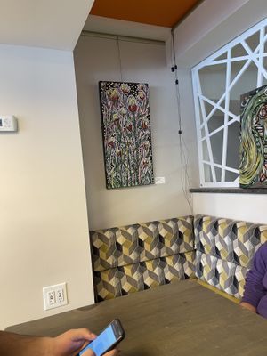 Paintings on sale on the wall   at Good Eats Cafe in Ottawa