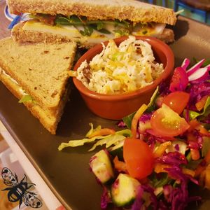 We offer a range of sandwiches, including the mozzarella & red pesto shown here. Our favourite is the coronation chickpea though. All available as paninis! at Bumbles' Rest Cafe in Ambleside
