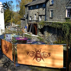 Our outdoor seating area overlooks a gorgeous section of Stock Ghyll, not to mention the waterwheel of the old mill. at Bumbles' Rest Cafe in Ambleside