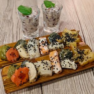 Vegan Amazake Ginger Welcome Drink; Amuse Bouche with Housemade Ume Pickles, Kasuzuke, Shiokojizuke, Vegan Kimchi, Asazuke, Lotus Su Renkon at WakaMama in Central Singapore