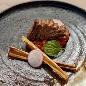 Meatless Jackfruit Cube with Sautéed Lemongrass & Perfume Mint Leaf on Cherry Tomato Onion Sauce at WakaMama in Central Singapore