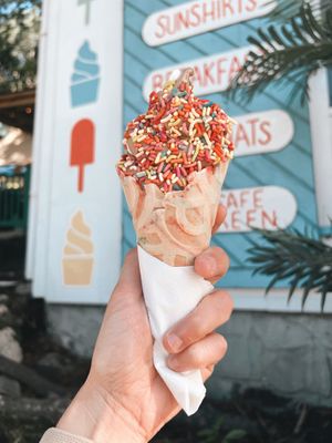 Soft serve swirl in birthday cake waffle cone and rainbow sprinkles   at Irie Pops in St John