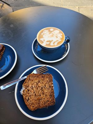 Cappuccino and vegan coconut bread. at Lot Sixty One Coffee in Valletta