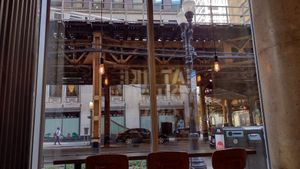View of the el from the counter seats at Stand-Up Burgers - Wells in Chicago