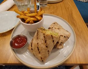 One of the wraps with a side of fries at Fresh Kitchen + Juice Bar Hurontario in Mississauga