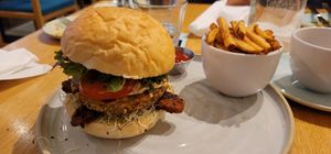 Same burger with the top on (its very tall 😳) at Fresh Kitchen + Juice Bar Hurontario in Mississauga