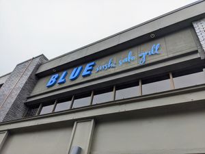 On the street side of the Domain facing MoPac and Esperanza Crossing. at Blue Sushi Sake Grill in Austin