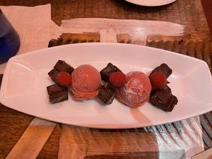 Desert raspberry sorbet and chocolate. Delicious   at Blue Sushi Sake Grill in Austin