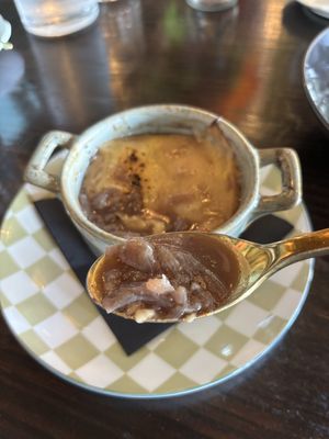 Vegan French onion soup! The hot bubbling cheese on top is made with their homemade cashew cheese!!!  at Ka Papa Cuisine in Sarasota