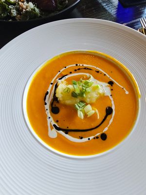 Creamy carrot soup w 'potato cream' in center (gluten free) at Ka Papa Cuisine in Sarasota