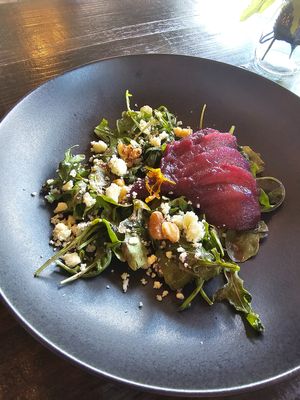 Poached pear and 'blue cheese' salad w caramelized walnuts, arugula, and port wine balsamic vinaigrette dressing (gluten free)  at Ka Papa Cuisine in Sarasota