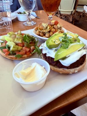 Vegan burger with chickpea side   at The Cafe in Naples