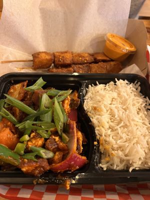 Dynamite tofu (front), Potatoes - street stick food (back)  at CAFEMANDU in Irving