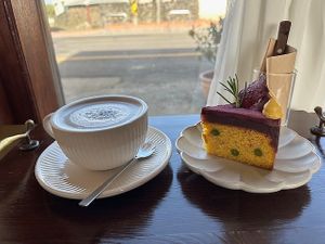 Black Sesame Latte and Pumpkin Cake slice with Purple Sweet Potato frosting (V, GF).  at Pengohoda - 펜고호다 in Jeju