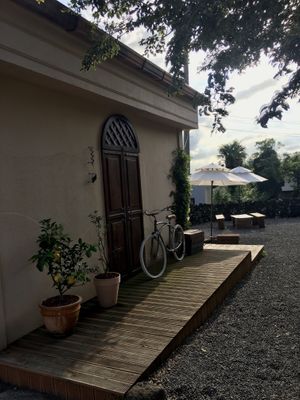 Side of the cafe leading to the outdoor seating at the back  at Pengohoda - 펜고호다 in Jeju