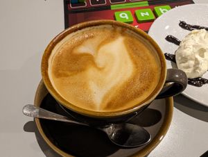 Latte with oat milk at Slice + Dice in Norwich