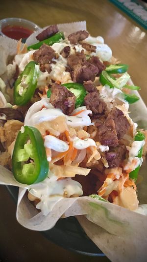 They run weekly specials ! this weeks was , banh mi fully  loaded tater tots from Mars!   at Tony's Darts Away in Burbank