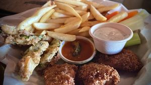 The Super Bowl Vegan Trio ! Fried pickles, 🥒 buffalo wings , french fries! 🍟   at Tony's Darts Away in Burbank
