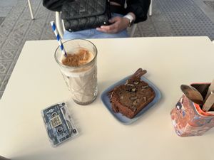 Banana bread and iced chai oat latte   at Faire Brunch & Drinks in Barcelona