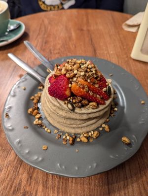 Pancakes with strawberries and granola at Maria Rosa in Ponte De Lima