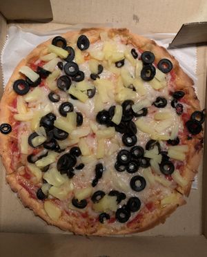 Vegan pizza with GF crust! pineapple & black olives  at Pizzeria Bacio Ristorante in Poughkeepsie