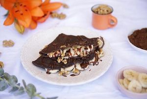 La Golosa!
crepe hecha de cacao, rellena de plátanos, pasta de maní casera, chocolate fundido, trozo de nueces y azúcar flor. at Cookrepe Vegan in Santiago