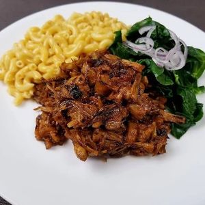 BBQ jackfruit, creamy coconut mac n cheese, braised collard greens with pickled onion at Plant Power Nashville  in Brentwood