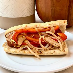 San Gennaro Italian Sausage - beyond italian sausage, peppers and onions, baguette at Vegan City Hawai'i in Honolulu