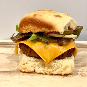 To Infinity and Beyond Burger - Classic - lettuce, tomato, pickles, onions, ketchup & mustard at Vegan City Hawai'i in Honolulu