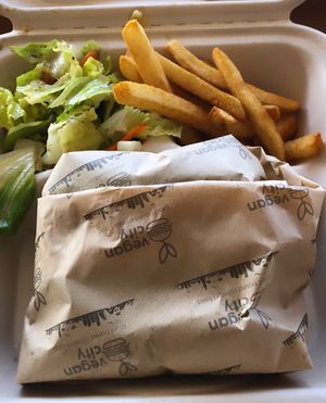beyond burger on lettuce, salad, fries!  at Vegan City Hawai'i in Honolulu