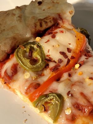 Daiya cheeze, bell peppers & jalapeños  at Woodstock's Pizza in Davis