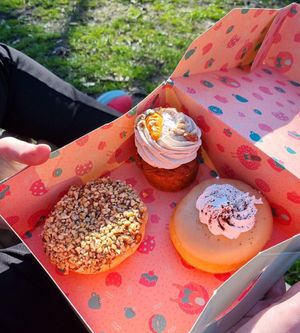 Carrot cupcake with sweet cinnamon topping, nougat doughnut (left) sprinkled with lots of hazelnuts and a tiramisu doughnut (right) with a delicious coffee icing and fluffy cream! at Kjeks - Schanze in Hamburg
