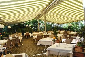 Big garden in the back of the building at Ristorante Cortile in Munich