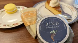 Pumpkin cheesecake, a French macaron, and the two cheeses I bought to take home,  at DC Vegan in Washington