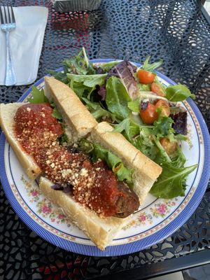 Meatball sandwich and salad   at DC Vegan in Washington