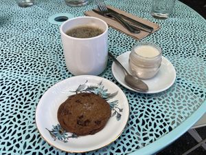 Chocolate chip cookie and coffee with soy milk   at Acorn Community Cafe in Eugene