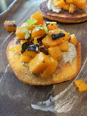 Blinis de garbanzo, calabaza y emulsión de pipas  at Fat Veggies in Barcelona