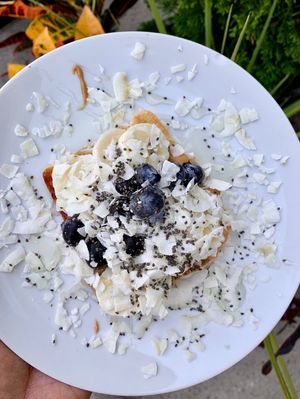 PB+B toast. Just look at this beauty! PB, banana, blueberry, coconut flakes, chia seeds, agave.  at Power Plant Juice Bar in Centerville