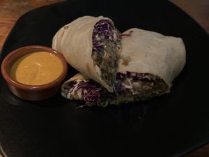 Burrito with guac, crema, and pea protein at Vida Cantina SF in San Francisco