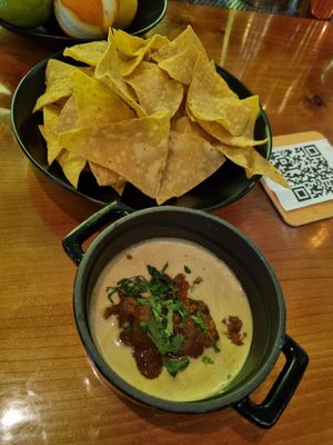 Nachos with delicious queso sauce🤤 at Vida Cantina SF in San Francisco