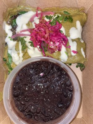 Roasted poblano, jalapeño, tomatillo sauce blended with cashew creama, stuffed with black bean, mushroom, spinach, onion & cashew cheese, creamy &  side of black beans   at Vida Cantina SF in San Francisco