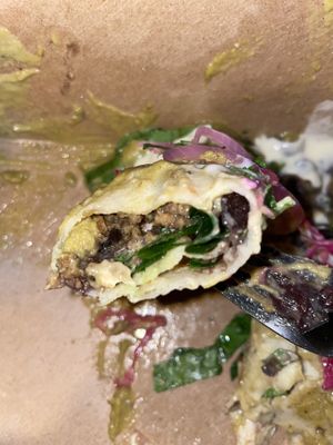 Roasted poblano, jalapeño, tomatillo sauce blended with cashew creama, stuffed with black bean, mushroom, spinach, onion & cashew cheese, creamy & delightful!  at Vida Cantina SF in San Francisco